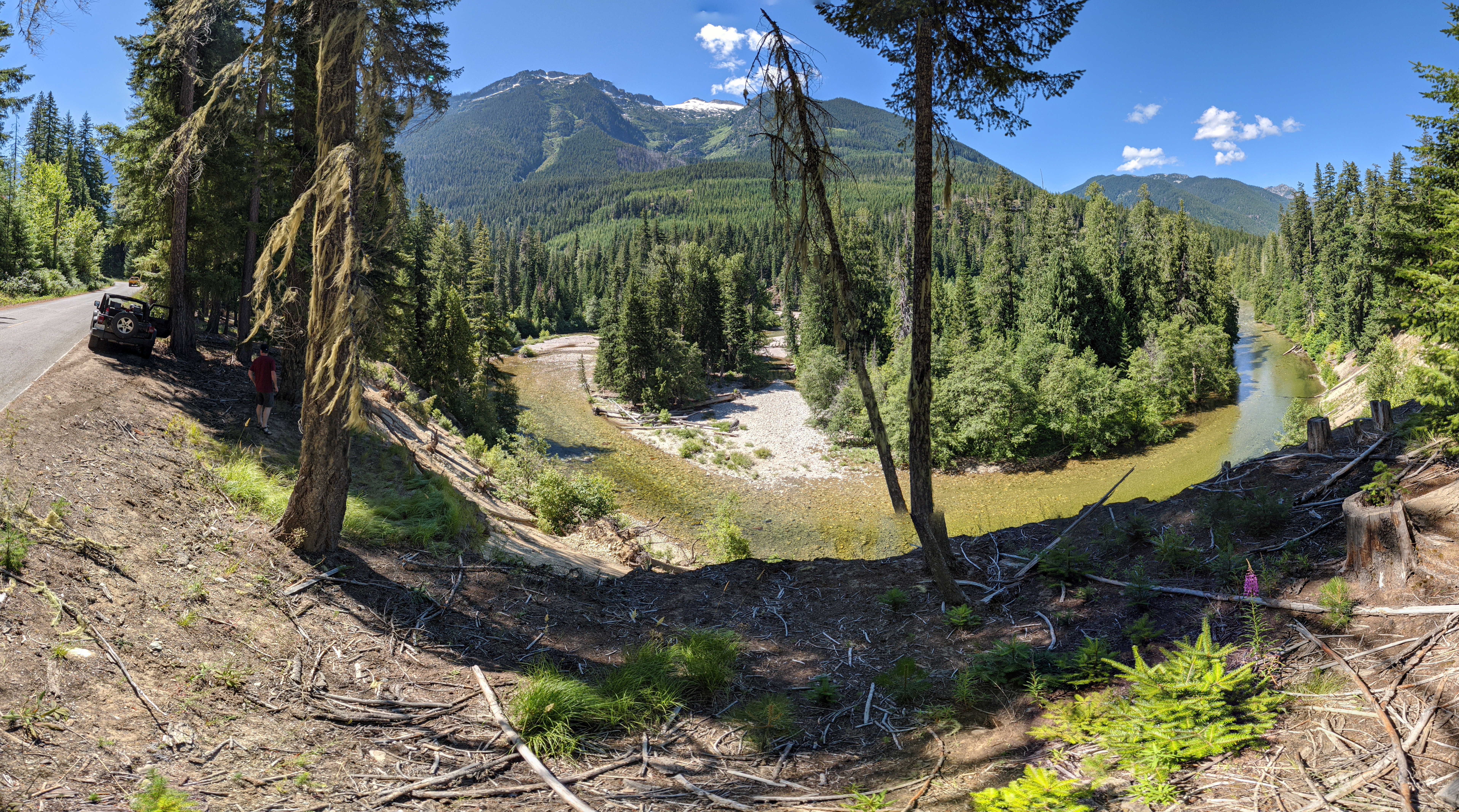 River flowing around the bend with a view of mountains on the horizon